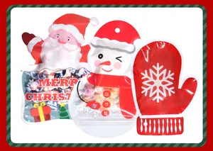 Detail view of three Christmas self-sealing bags in Santa, snowman and mitten shapes