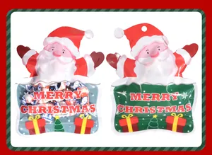 Detail of Santa Claus shaped Christmas gift bags for holiday candy packaging