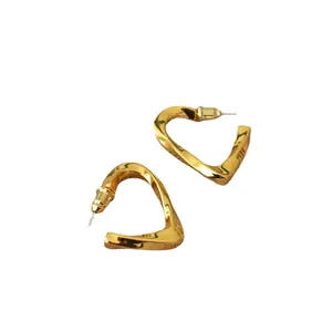 Minimalist gold-plated twisted heart stud earrings with a glossy metallic finish