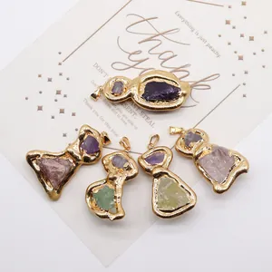 Five pieces of raw crystal stone pendants with golden plated irregular textured edges