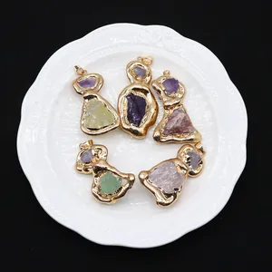 Irregular natural raw stone pendants with gold plated edges in various crystal colors