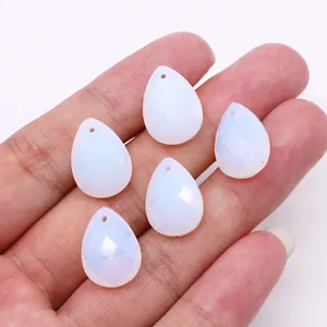 Faceted teardrop opalite stone pendants for DIY necklaces shown in hand for scale