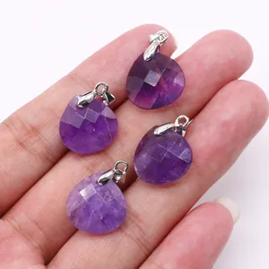 Macro shot of four faceted purple amethyst heart pendants with silver metal clasps