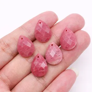 Detailed view of five faceted teardrop pink natural stones for DIY jewelry making