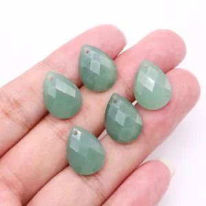 Macro shot of five faceted green aventurine teardrop charms for DIY jewelry making