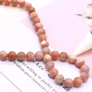 Polished natural sunstone round beads in peach orange for DIY jewelry making