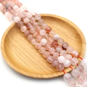 Natural round red lepidocrocite quartz beads for DIY jewelry making on wooden tray