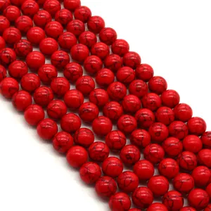 Fili di perle tonde in turchese rosso lucido con matrice nera per la creazione di gioielli