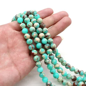 Detailed view of polished sea sediment jasper round beads for DIY jewelry making