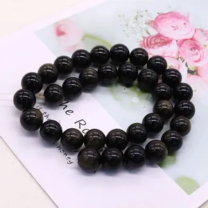 Bracelet double rang en perles d'obsidienne dorée avec texture pierre sur carte florale