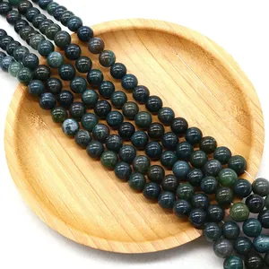 Polished natural green moss agate round beads for DIY jewelry making on wood tray