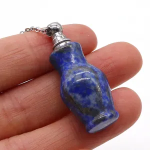 Macro shot of a blue lapis lazuli perfume bottle pendant on a fine silver chain