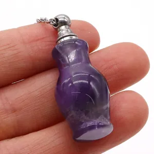 Detail of small flower vase shaped amethyst crystal perfume bottle necklace with silver cap