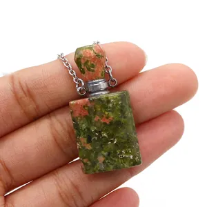 Detail of unakite stone perfume bottle pendant with metallic cap and chain