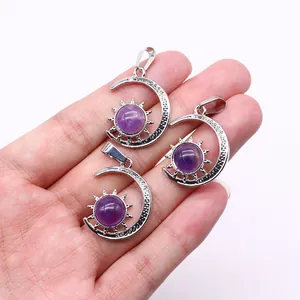 Detailed close-up of three celestial silver pendants with purple amethyst stones