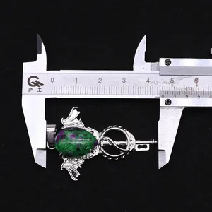 Measurement of angel wing amethyst pendant width showing 44mm on a metal caliper