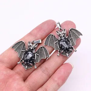 Gothic bat pendants in vintage silver alloy with snowflake obsidian stones in hand
