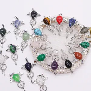 Bohemian angel wing key pendant with teardrop natural stones and silver plating