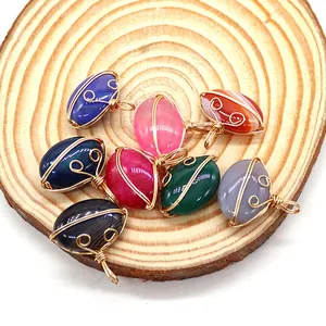 Oval wire-wrapped natural stone pendants in multiple colors with gold metal detailing
