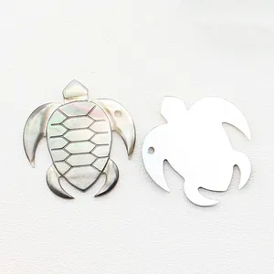 Engraved turtle shaped sea shell pendant in natural iridescent mother of pearl