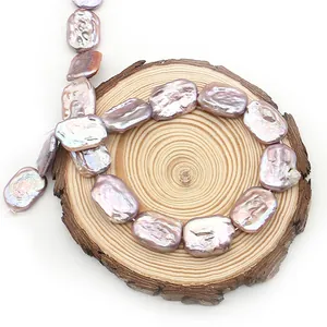 Metallic lavender baroque freshwater pearls strands on wood for DIY jewelry making