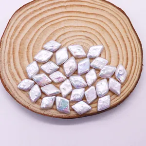 Iridescent baroque freshwater pearls in lozenge shape for DIY jewelry making on wood