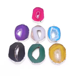 Set of seven irregular natural geode agate pendants with silver plated edges and hooks