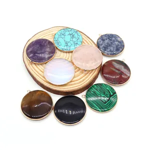Set of round natural stone pendants with gold plated borders including turquoise and tiger eye