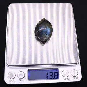 Marquise cut labradorite stone showing 13.8g weight on a digital scale for DIY jewelry