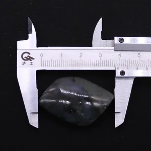 Detailed macro view showing a 40mm marquise labradorite stone with blue flash and caliper
