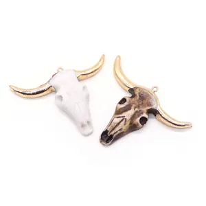 Resin bull skull pendants in white and brown with golden horns for DIY jewelry
