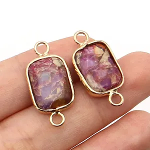 Close-up of rectangular purple imperial stone connector with gold plated metal frame