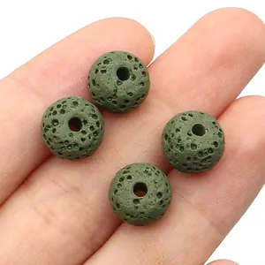 Close-up of olive green lava stone beads showing porous texture for DIY jewelry making