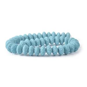 Close-up of light blue volcanic lava stone beads with natural honeycomb texture for DIY