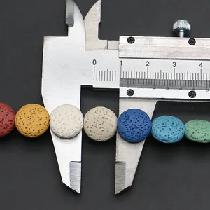 Macro detail of 10mm colorful flat round lava stone beads measured with a digital caliper