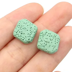 Detailed close-up of light green porous lava stone beads for DIY jewelry making