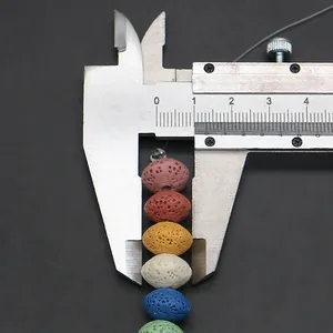 Measuring 8mm colorful oval porous lava beads with a caliper for DIY jewelry making