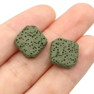 Macro view of olive green square lava stone beads showing natural porous texture