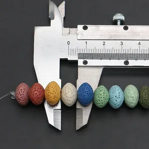 Macro shot showing 9mm colorful lava rock beads measurement with a caliper