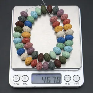 Digital scale weighing colorful oval lava stone spacer beads for DIY jewelry making
