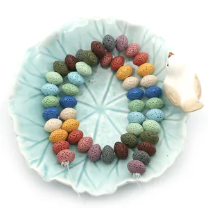 Colorful natural volcanic lava rock spacer beads in a ceramic bowl for DIY jewelry
