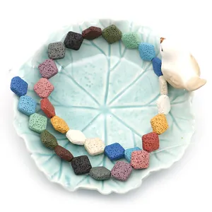 Colorful cube-shaped volcanic lava stone beads for DIY jewelry in a ceramic dish