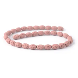Macro di perline ovali in pietra lavica rosa con trama porosa per creazioni di gioielli