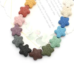 Multi-colored star shaped volcanic lava stone beads arranged on a white decorative card