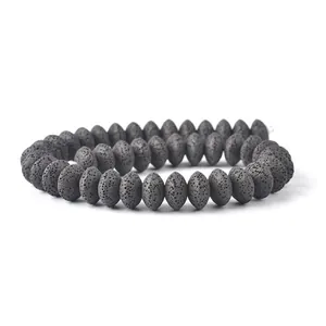Macro shot of natural grey lava stone abacus beads showing porous texture for DIY jewelry