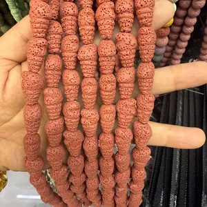 Macro shot of natural orange lava stone beads in spiral shell shape for DIY jewelry making