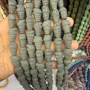 Detailed macro view of gray volcanic rock beads in unique pinecone spiral shapes