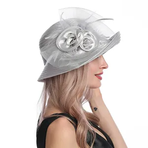 Detail of silver grey mesh sun hat with handmade flowers, feathers and elegant satin ribbon