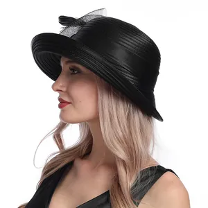 Detail of elegant black satin sun hat with mesh bow decoration for women fashion