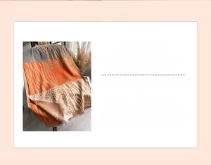 Close-up of thick winter scarf featuring orange zebra print color block and tassels